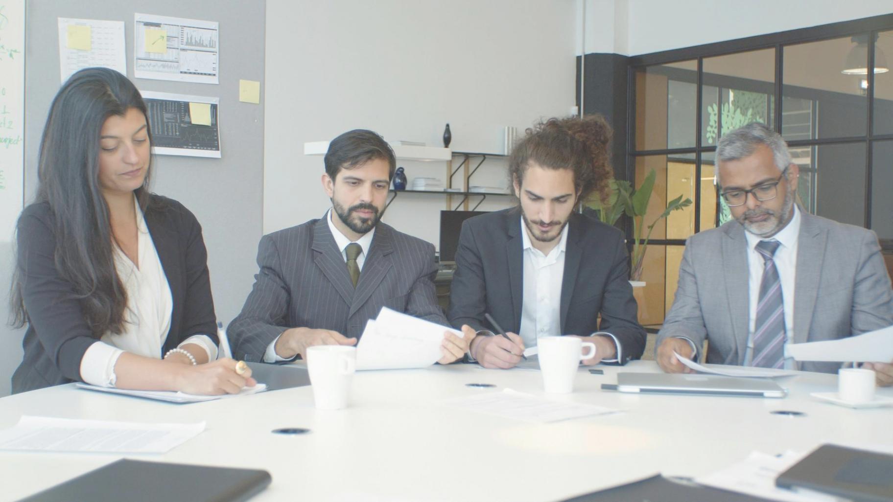 Legal professionals collaborating on contract review