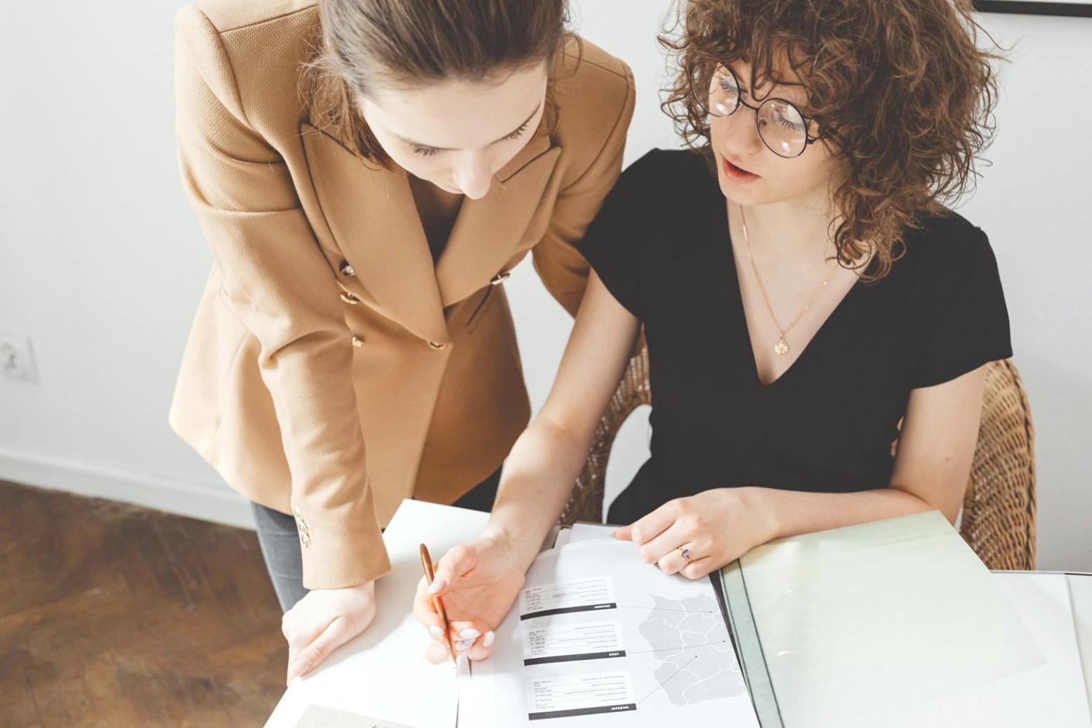 Team members collaborating in Huvina's bright office space